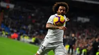 Bek Real Madrid, Marcelo, menegaskan sama sekali tak berniat untuk hengkang ke klub lain pada bursa transfer musim panas tahun ini. (AFP/GABRIEL BOUYS)