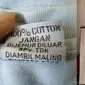 Tulisan nyeleneh di label baju (Sumber: Twitter/nikhmaula/unmanfaat)