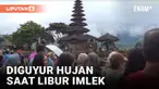 Walaupun diguyur hujan, momen liburan panjang bertepatan dengan Hari Imlek 2024, dimanfaatkan sejumlah pengunjung untuk mengunjungi objek wisata Ulun Danu di Tabanan, Bali.
