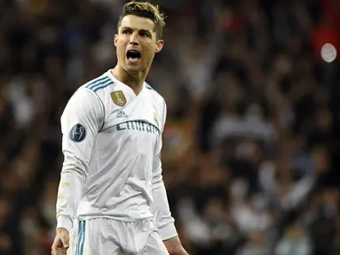 Bintang Real Madrid, Cristiano Ronaldo merayakan golnya ke gawang Juventus pada leg kedua perempat final Liga Champions di Santiago Bernabeu stadium, Madrid, (11/4/2018). Real Madrid menang agregat 4-3. (AFP/Peirre-Philippe Marcou)