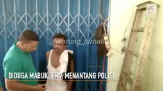 Diduga mabuk, seorang Pria mengamuk dan menantang Polisi berkelahi.