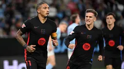 Barcelona sempat unggul dua gol. Gol pembuka keunggulan Blaugrana dicetak Raphinha pada menit ke-15. (MIGUEL RIOPA/AFP)