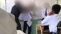 Tangkapan layar video viral guru hantam kepala siswasnya di Surabaya (Liputan6.com/Istimewa)