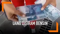 Seorang petugas SPBU menyiram uang kertas pecahan Rp 50 ribu dengan bensin. Padahal uang itu baru dibayarkan seorang pengendara mobil untuk mengisi bahan bakar. Ternyata ini alasannnya!