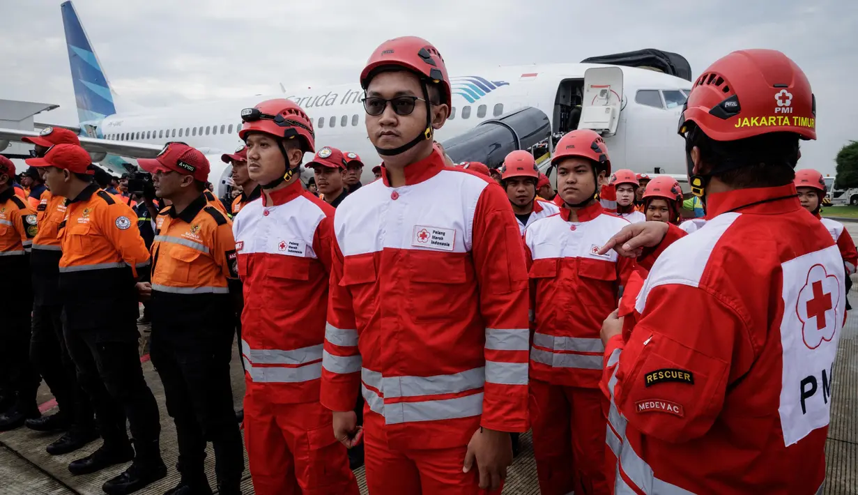 Tim gabungan tersebut berasal dari berbagai instansi, di antaranya Kementerian Koordinator Bidang Pembangunan Manusia dan Kebudayaan, Kementerian Kesehatan, BNPB, dan Basarnas. (YASUYOSHI CHIBA/AFP)