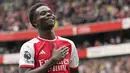 Pemain Arsenal, Bukayo Saka melakukan selebrasi setelah mencetak gol ke gawang Bournemouth pada laga pekan ke-36 Premier League 2023/2024 di Stadion Emirates, Sabtu (4/5/2024). (AP Photo/Frank Augstein)