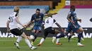 Penyerang Arsenal, Pierre-Emerick Aubameyang, berusaha melepaskan tendangan ke gawang Fulham pada laga Liga Inggris di Craven Cottage, London, Sabtu (12/9/2020) malam WIB. Arsenal menang 3-0 atas Fulham.  (Ben Stansall/Pool via AP)