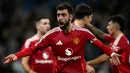 Gol Bruno Fernandes dari titik putih berhasil menyamakan kedudukan pada menit ke-88. Dua menit kemudian, Amad Diallo mencetak gol kemenangan yang sensasional di akhir pertandingan untuk Manchester United, juara Liga Inggris 20 kali itu. (Paul ELLIS/AFP)