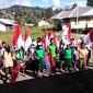 Anak -anak Papua Ramai-ramai Kibarkan Bendera Merah Putih (Istimewa)