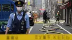 Petugas pemadam kebakaran dan polisi bekerja di lokasi ledakan di sebuah gedung di Tokyo, Jepang, Senin (3/7/2023). Sebanyak empat orang terluka akibat kejadian tersebut. (AP Photo/Eugene Hoshiko)