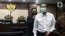 Terdakwa suap penanganan perkara korupsi di Lampung Tengah yang juga mantan Wakil Ketua DPR Azis Syamsuddin usai sidang pembacaan putusan di Pengadilan Tipikor Jakarta, Kamis (17/2/2022). Azis Syamsuddin divonis hukuman 3 tahun 6 bulan penjara dan denda Rp 250 juta. (Liputan6.com/Helmi Fithriansyah)