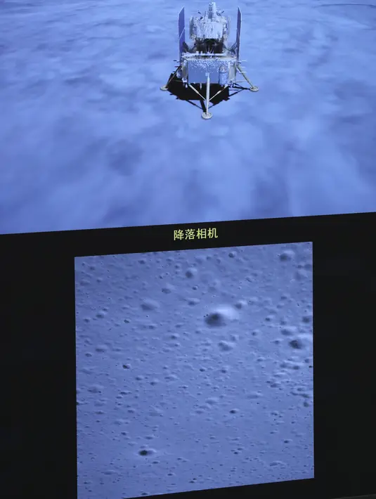 Foto yang diabadikan di Beijing Aerospace Control Center pada 1 Desember 2020 menunjukkan gambar Chang'e-5 saat pendaratan di Bulan. Wahana antariksa itu mendarat di area pendaratan yang telah dipilih sebelumnya di dekat 51,8 derajat bujur barat dan 43,1 derajat lintang utara. (Xinhua/Jin Liwang)