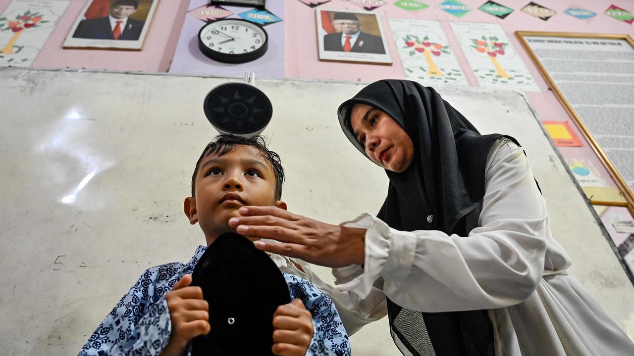 FOTO: Antusias Murid Madrasah Jalani Pemeriksaan Kesehatan Gratis