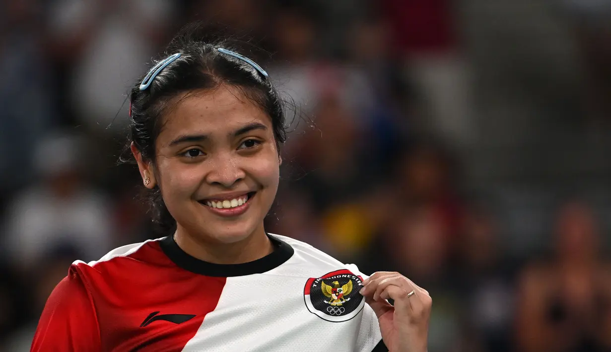 Gregoria Mariska Tunjung menutup set kedua dengan keunggulan 21-9. (ARUN SANKAR/AFP)