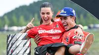 Pembalap Ducati Lenovo, Marc Marquez, bersama kekasihnya, Gemma Pinto, merayakan keberhasilan menjuarai MotoGP 2025 di Sirkuit Motegi, Jepang, Minggu (28/09/2025). (AFP/Toshifumi Kitamura)