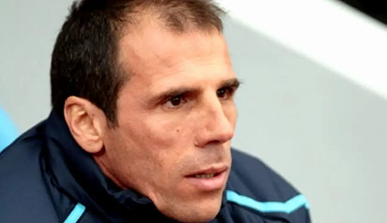 West Ham Manager Gianfranco Zola watches players warm up ahead of a Premiership match against Portsmouth at Boleyn Ground, London, on November 15, 2008. AFP PHOTO/Leon Neal