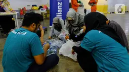 Allianz Indonesia konsisten mendukung program Bank Sampah sejak tahun 2018 di gedung kantor pusat Allianz Indonesia dengan mengajak karyawan dan masyarakat sekitar untuk membawa sampah yang telah dipilah untuk disetorkan ke Bank Sampah sehingga memiliki nilai produktif. (Liputan6.com/Pool/Allianz)