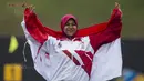 Pepanah putri Indonesia, Sri Ranti, merayakan kemenangan pada SEA Games cabang panahan nomor compound di National Sports Council, Kuala Lumpur, Rabu (16/8/2017). Dirinya meraih emas pertama untuk Indonesia. (Bola.com/Vitalis Yogi Trisna)