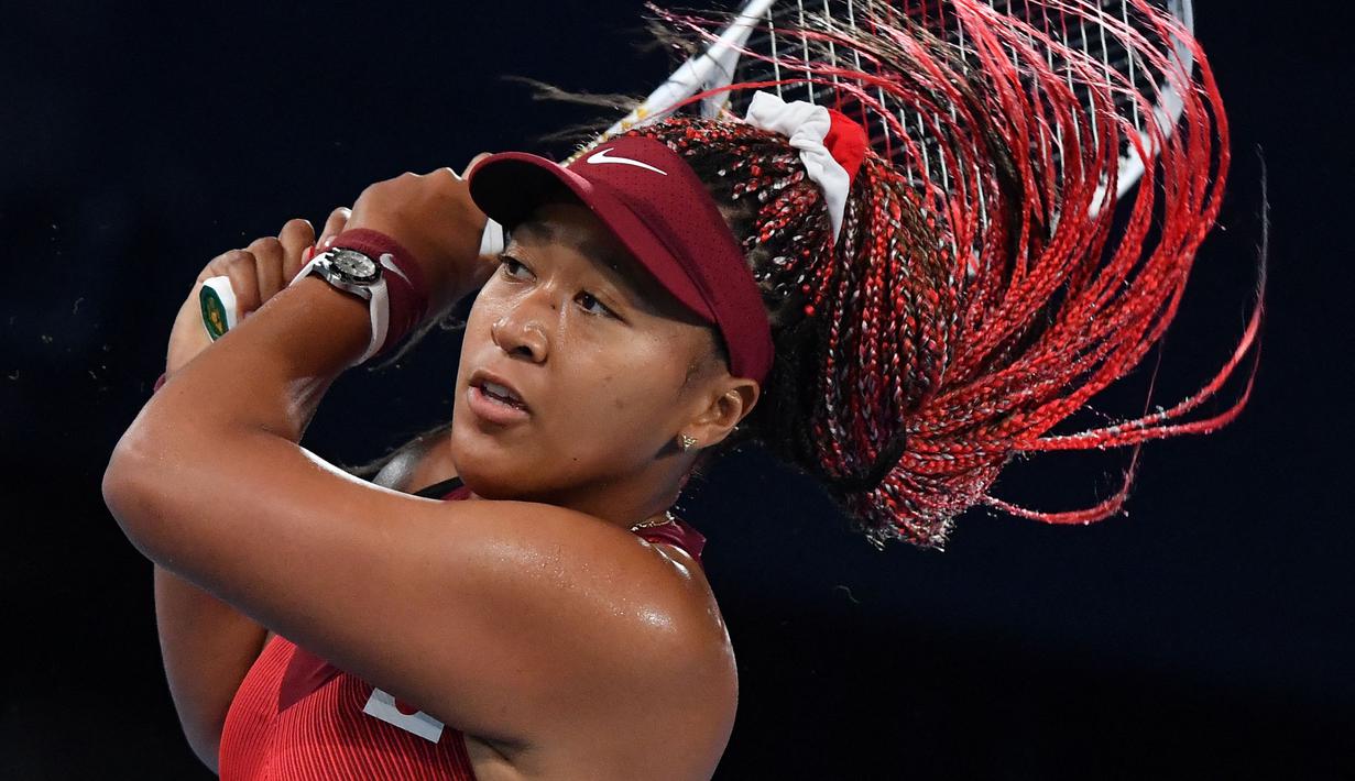 Naomi Osaka mengaku menghadapi tekanan yang besar ketika tampil di Olimpiade Tokyo 2020. Ia merasa sedih dengan kekalahan ini, namun dirinya juga senang dan bangga dapat bermain di Olimpiade Tokyo 2020. (Foto: AFP/Tiziana Fabi)