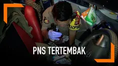 Seorang anggota PNS mendadak terluka saat menyetir mobil. Diduga ia terkena peluru nyasar.