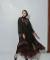 Dress hitam berbahan tile dengan motif bunga dan detail payet pada bagian dada sangat anggun untuk dikenakan pada acara buka bersama di hotel. (instagram/zaskiasungkar15)