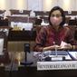 Menkeu Sri Mulyani bersiap mengikuti rapat kerja dengan Komisi XI DPR di Kompleks Parlemen, Senayan, Jakarta, Senin (15/3/2021). Rapat membahas konsultasi terkait usulan perubahan pengelompokan/skema barang kena pajak berupa kendaraan bermotor yang dikenai PPnBM. (Liputan6.com/Angga Yuniar)
