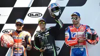 Marc Marquez (kiri), Johann Zarco (tengah), dan Danilo Petrucci (kanan) akan mengisi tiga posisi terdepan saat start MotoGP Prancis 2018. (JEAN-FRANCOIS MONIER / AFP)