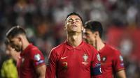 Cristiano Ronaldo. Ia hanya mampu membawa Portugal menempati posisi kedua Grup A di bawah Serbia dan harus memainkan laga play-off. Total telah tampil dalam 4 edisi Piala Dunia berurutan mulai 2006 hingga 2018 dengan mencetak 7 gol dan 2 assist dari 17 laga. (AFP/Patricia De Melo Moreira)