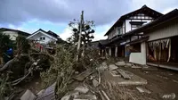 Sebuah rumah yang rusak akibat banjir di Nagano, setelah Topan Hagibis menghantam Jepang pada 12 Oktober melepaskan angin kencang, hujan lebat dan memicu tanah longsor dan bencana banjir. (Foto: AFP / Kazuhiro NOGI)