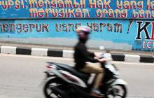 Mendidik antikorupsi dengan cerpen, puisi dan karikatur