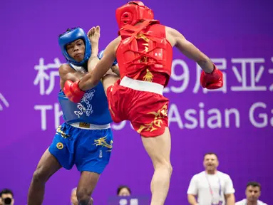 Cabang wushu kembali menambah perbendaharaan medali Kontingen Indonesia pada ajang Asian Games 2022, Kamis (28/9/2023). Adalah Samuel Marbun yang berlaga di nomor sanda kelas 65kg putra yang memastikan merebut medali perak setelah kalah dari atlet asal Iran, Afsin Shalimi Toupghara dalam laga final yang digelar di Xiaoshan Guali Sports Centre, Hangzhou, China. Hasil ini tergolong luar biasa bagi atlet asal Sumatera Utara tersebut yang menjalani debutnya di Asian Games Hangzhou 2022. (NOC Indonesia/Naif Al'as)