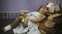 Dan di antara mereka adalah bayi baru lahir dan balita, pembaca setia, calon jurnalis, dan anak-anak yang mengira mereka akan aman berada di dalam gereja. (AP Photo/Abdel Kareem Hana)