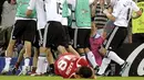 German teammates celebrate as Turkish midfielder Kazim Kazim lies on the ground after the Euro 2008 championships semi-final football match Germany vs. Turkey on June 25, 2008 at St. Jakob-Park stadium in Basel, Switzerland. AFP PHOTO DDP / THOMAS LOHNES
