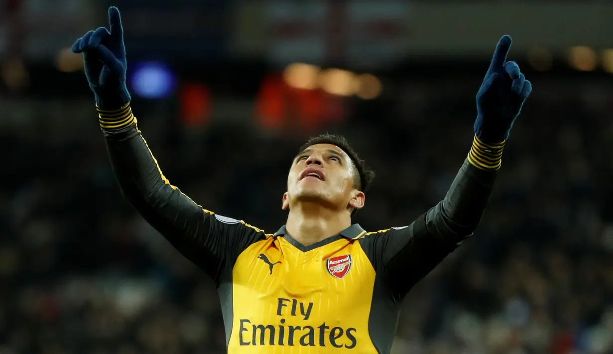 Ekspresi Alexis Sanchez setelah mencetak gol ketiga ke gawang West Ham United. (Action Images via Reuters/John Sibley)