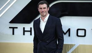 Gareth Bale berpose di karpet merah saat tiba di Premier Eropa F1 The Movie, di Cineworld Leicester Square, London pusat, pada 23 Juni 2025. (HENRY NICHOLLS/AFP)