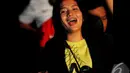 Senyum Simpatisan United saat menghadiri acara Ulang tahun ke-3 Simpatisan United di Hall A Senayan, Jakarta, Sabtu (20/12/2014). (Liputan6.com/Faisal R Syam)