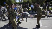Latihan Evakuasi 2016 tentara Israel (AP Photo/Sebastian Scheiner)