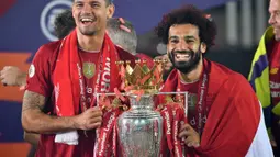 Kontribusi Mohamed Salah di lini serang sukses mengantarkan Liverpool mengakhiri puasa gelar Liga Inggris selama 30 tahun terakhir pada musim 2019/2020. The Reds berhasil mendulang 99 poin dan 19 gol diantaranya diciptakan oleh winger asal Mesir tersebut. (AFP/Paul Ellis)