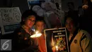 Aksi 1000 lilin untuk Angeline di Bundaran HI, Jakarta, Kamis (11/6/2015). Mereka mendoakan Angeline agar mendapat kedamaian di sisi Tuhan. (Liputan6.com/Johan Tallo)