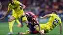 Atletico Madrid menang telak setelah melibas Cadiz dengan skor 5-1. (Photo by Pierre-Philippe MARCOU / AFP)