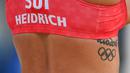 Joana Heidrich - Pemain voli pantai wanita Swiss Joana Heidrich memiliki tato bertuliskan Rio 2016 di sisi tulang rusuknya. Tato tersebut sebagai tanda Olimpiade pertama yang ia ikuti sepanjang kariernya. (Foto/AFP/Angea Weiss)