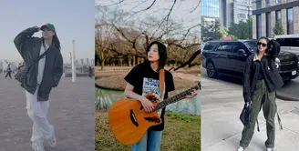 Jaket windbreaker dipadukan celana cargo juga nggak kalah menarik. Soal alas kaki, sneakers jadi andalan Zee. [@jkt48.zee]