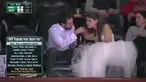 Setelah resepsi mereka langsung menyaksikan tim kesayangannya bertanding dan masih mengenakan gaun dan jas pengantin.