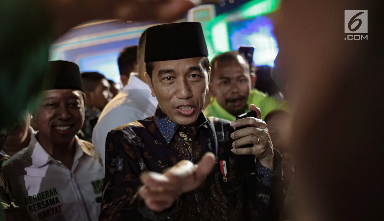 Presiden Joko WIdodo tiba menghadiri Harlah ke-46 PPP di kawasan Ancol, Jakarta, Kamis (28/2). harlah ke-46 PPP mengusung tema ‘Membangun Keluarga Membangun Bangsa’. (Liputan6.com/Faizal Fanani)