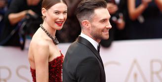 Rasa bahagia kembali diungkapkan pasangan Adam Levine dan Behati Prinsloo. Terlihat dari unggahan foto di akun instagram Behati, foto tampak belakang Adam dengan tattoo terbarunya di bagian punggung. (AFP/Bintang.com)