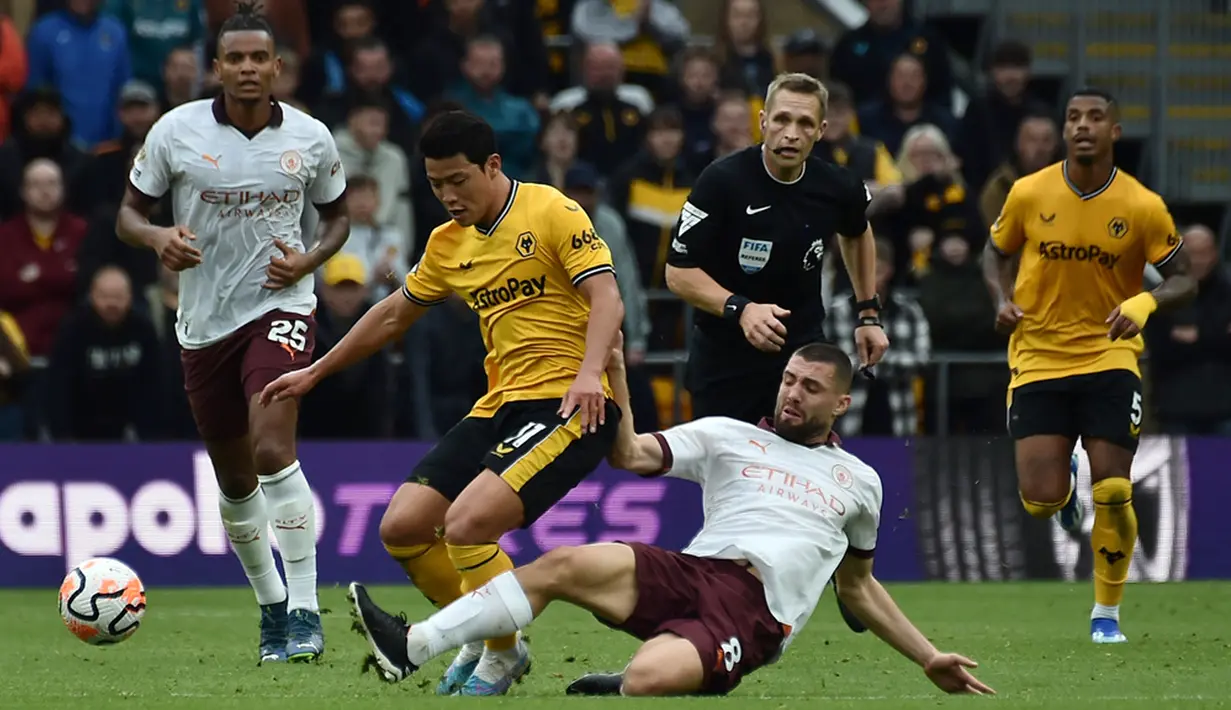 Juara bertahan sekaligus pimpinan klasemen sementara Liga Inggris 2023/2024 Manchester City tersandung untuk kali pertama pada musim ini. Pasukan Pep Guardiola menyerah 1-2 dari Wolverhampton Wanderers. (AP Photo/Rui Vieira)