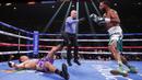 Petinju Anthony Dirrell (kanan) menjatuhkan Marcos Hernandez saat pertandingan tinju kelas menengah super yang berlangsung di Las Vegas, Sabtu (6/11/2021). (AP Photo/Steve Marcus)