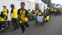 Herianto Wahmiko merupakan atlet difabel asal Aceh yang meriahkan Bhayangkara Run 2017 di Lapangan Monas, Jakarta, Minggu (16/7/2017) (Bola.com/Zulfirdaus Harahap)