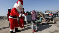 Warga Irak Rayakan Maulid Nabi dan Natal di Tengah Kepungan ISIS (Reuters)