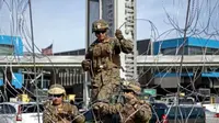 Presiden Trump memerintahkan pasukan ke daerah perbatasan beberapa hari sebelum pemilu tengah dan sebelum kedatangan kafilah imigran dari Amerika Tengah. (Guillermo Arias/AFP)